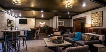 Tributary lounge with bar and seating at v2 apartments